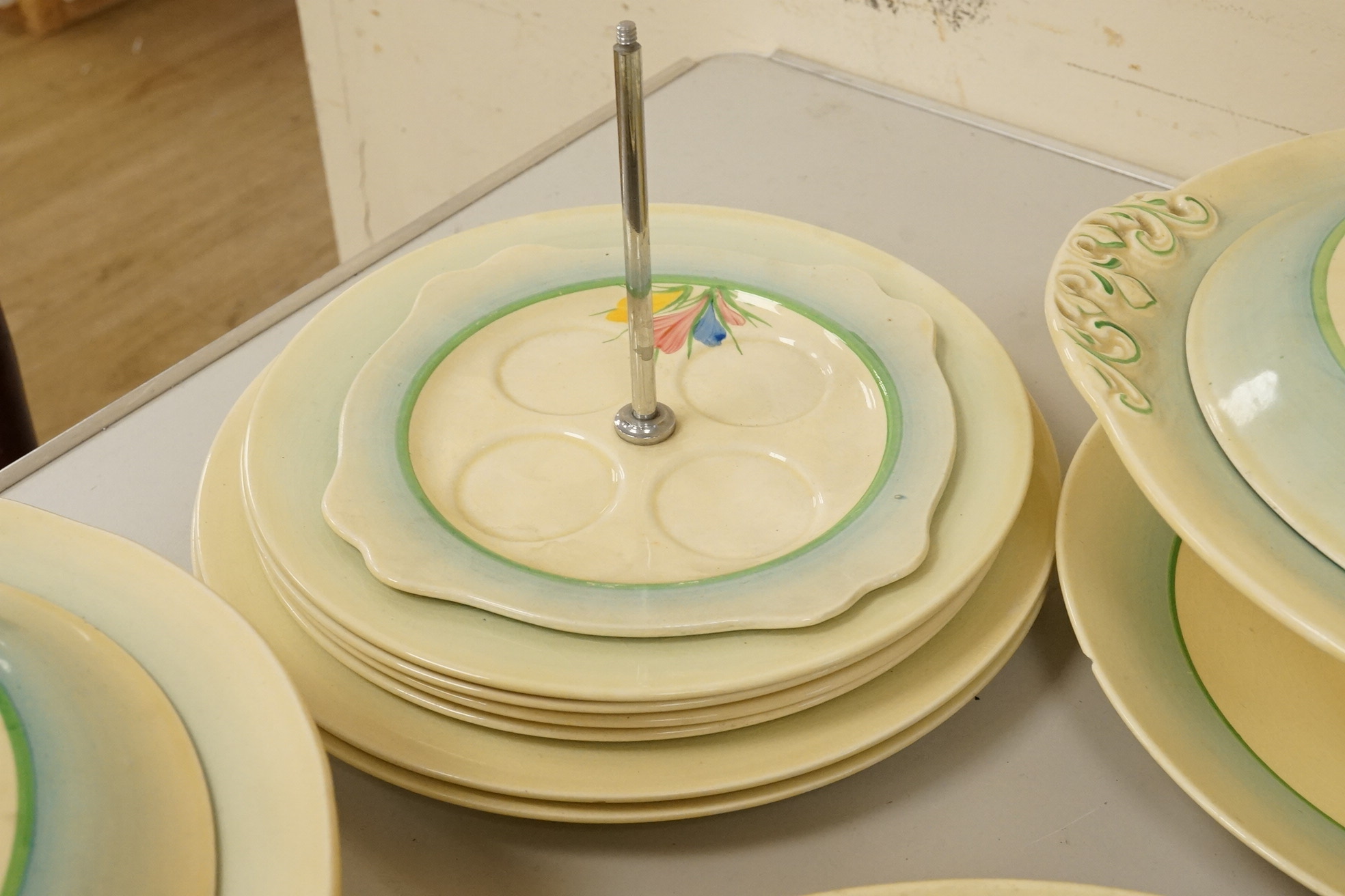 A collection of Clarice Cliff, Newport Pottery and Spring Crocus pattern tableware